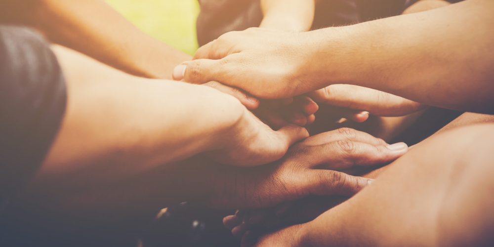 Business teamwork join hands together. Business teamwork concept Join Us in Supporting Student Mental Health